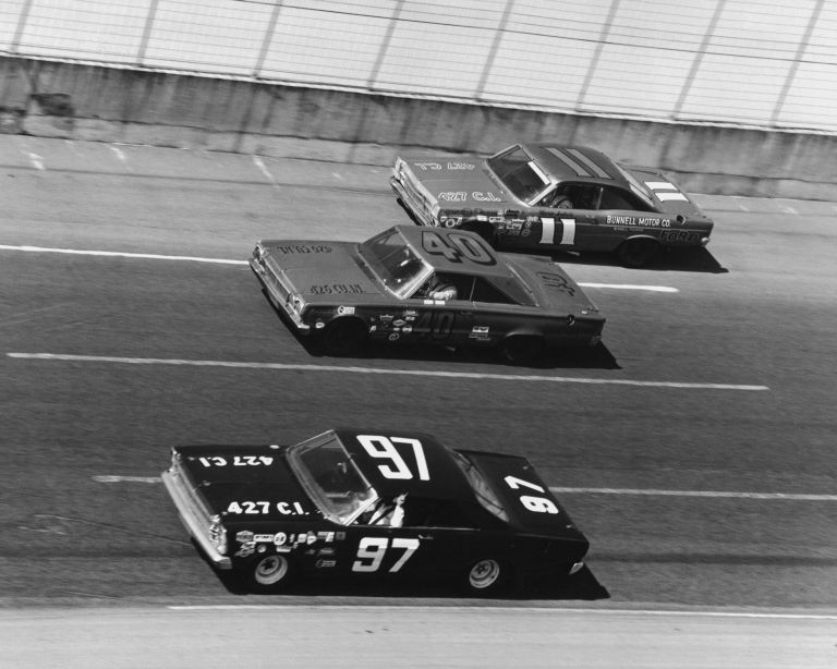 Mario Andretti passing cars in the marbles against the wall to win the 1967 Daytona 500. Only Andretti and Foyt went to Daytona and beat the NASCAR drivers at their own game, making them heroes outside the IndyCar fanbase.
