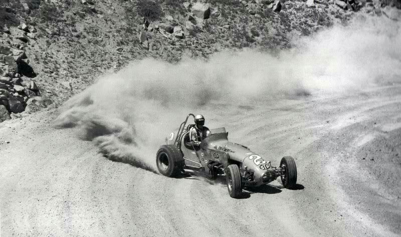 Mario Andretti powering his Chevy powered STP Special open wheel sprint car up the mountain at the 1969 Pikes Peak Hill Climb. He won.